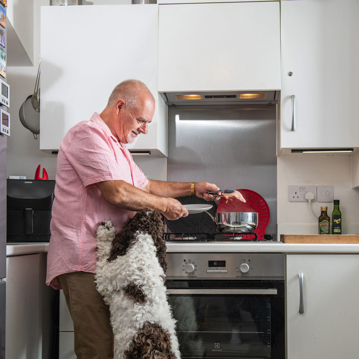 Photo of Sparrow-customer-with-dog-in-kitchen