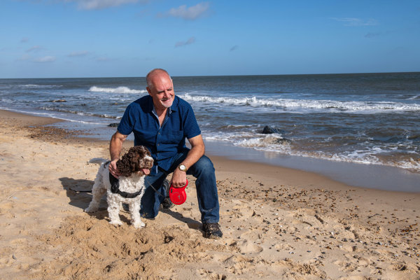 Sparrow customer with dog on the beach