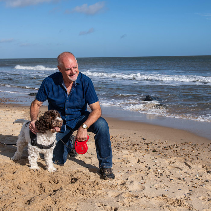 Sparrow customer and their dog on beach