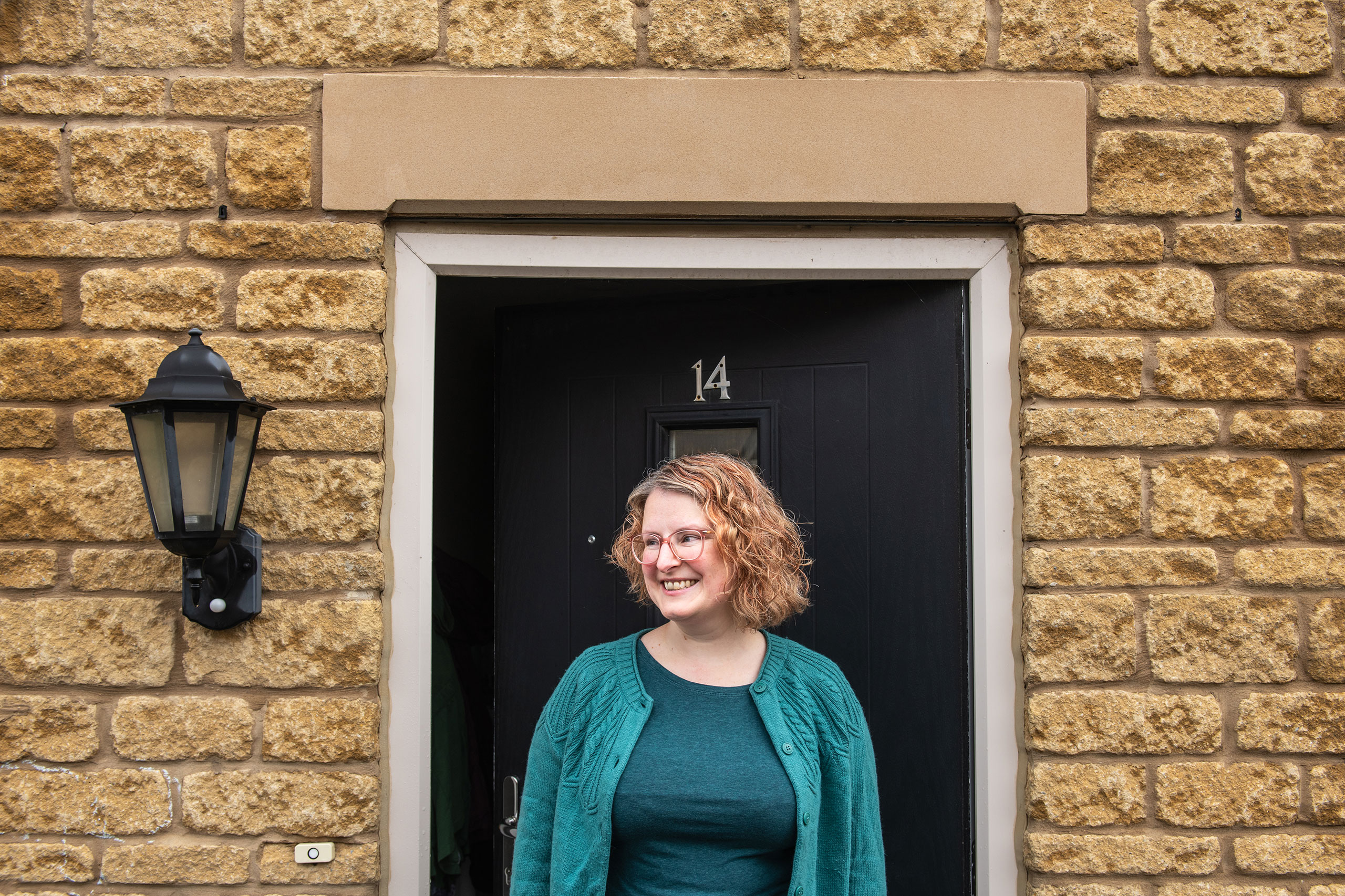 A Sparrow customer smiling in doorway